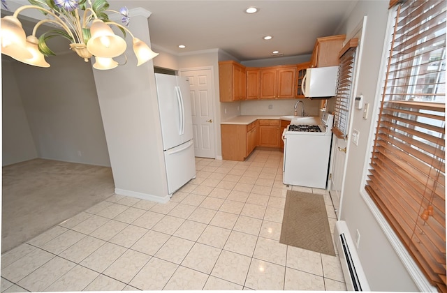 kitchen with white appliances, light colored carpet, light tile patterned floors, light countertops, and a sink