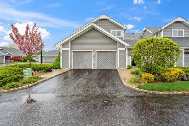 106 E Midland Pond Ct First Floor, First Floor, Moriches, NY 11955 - view of front of property with a garage and driveway