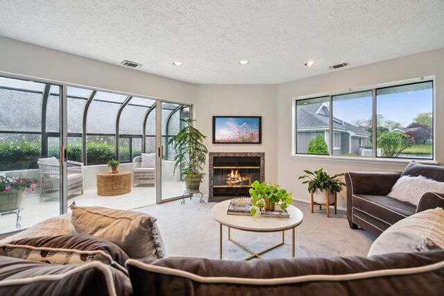 106 E Midland Pond Ct First Floor, First Floor, Moriches, NY 11955 - living room with a textured ceiling, carpet flooring, a fireplace with flush hearth, recessed lighting, and baseboards