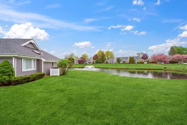106 E Midland Pond Ct First Floor, First Floor, Moriches, NY 11955 - view of grassy yard featuring a water view and central AC