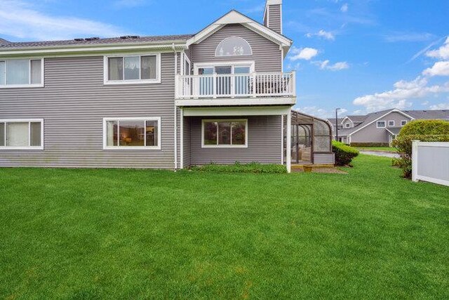 106 E Midland Pond Ct First Floor, First Floor, Moriches, NY 11955 - rear view of house featuring a balcony, a chimney, and a yard