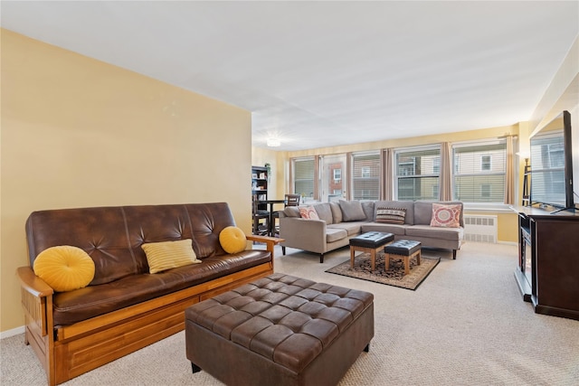 711 Shore Rd Unit 4F, Long Beach, NY 11561 - carpeted living room featuring radiator heating unit and baseboards