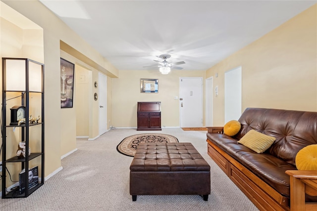 711 Shore Rd Unit 4F, Long Beach, NY 11561 - living area featuring light colored carpet, baseboards, and a ceiling fan