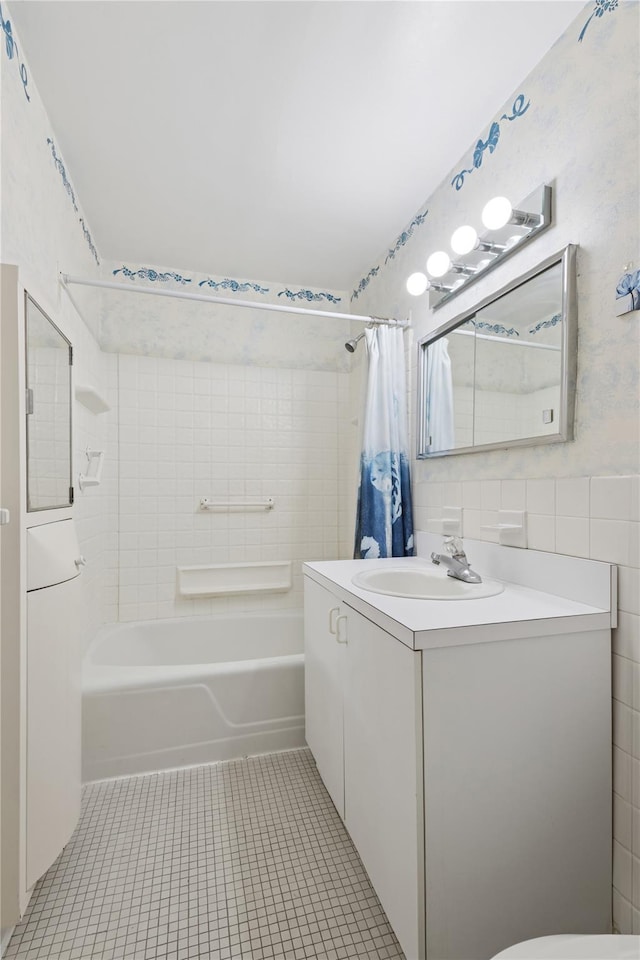 711 Shore Rd Unit 4F, Long Beach, NY 11561 - bathroom featuring shower / tub combo, vanity, tile patterned flooring, toilet, and tile walls
