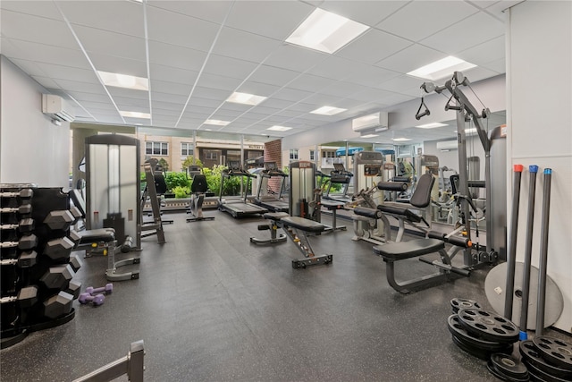 711 Shore Rd Unit 4F, Long Beach, NY 11561 - gym featuring a drop ceiling and an AC wall unit