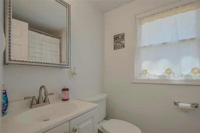 28 Lynncliff Rd, Hampton Bays, NY 11946 - bathroom featuring toilet and vanity