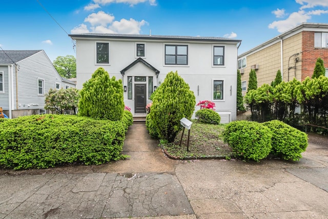 147 Florence St, Yonkers, NY 10704 - view of front facade featuring stucco siding