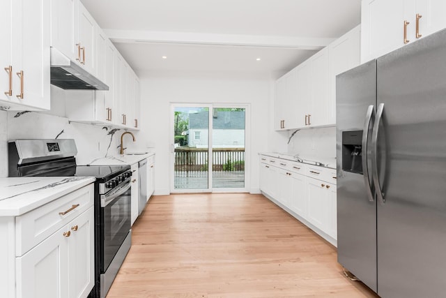 147 Florence St, Yonkers, NY 10704 - kitchen featuring stainless steel appliances, under cabinet range hood, a sink, decorative backsplash, and recessed lighting