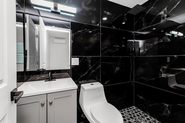 147 Florence St, Yonkers, NY 10704 - bathroom with vanity, toilet, and tile walls