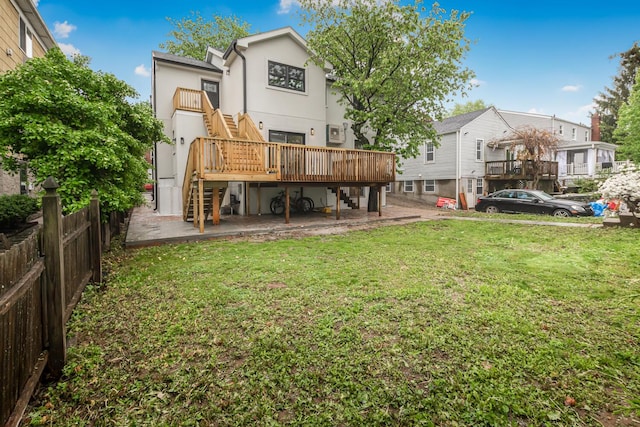 147 Florence St, Yonkers, NY 10704 - rear view of property with stairway, a deck, and stucco siding