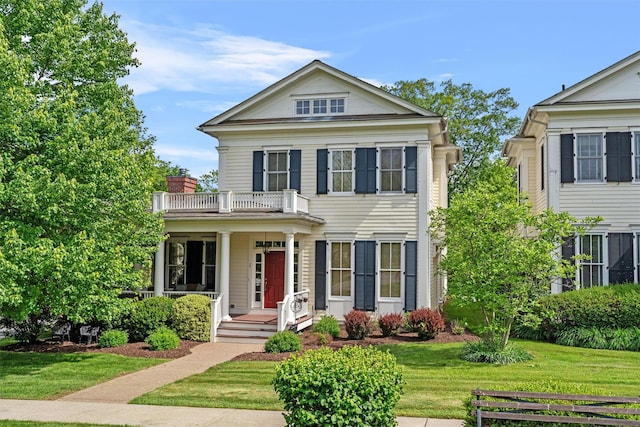 1 Sly St, Warwick, NY 10990 - greek revival inspired property featuring a balcony, a porch, and a front lawn