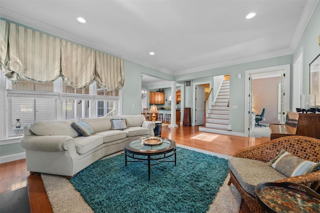 1 Sly St, Warwick, NY 10990 - living room featuring decorative columns, wood finished floors, ornamental molding, stairway, and baseboards