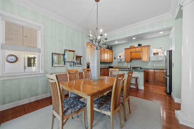 1 Sly St, Warwick, NY 10990 - dining room with dark wood finished floors, a chandelier, crown molding, and baseboards
