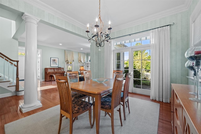 1 Sly St, Warwick, NY 10990 - dining area with wood-type flooring, stairs, a chandelier, crown molding, and decorative columns