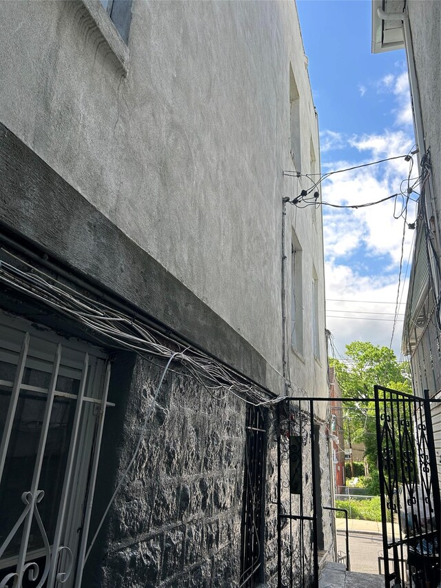 view of side of property with stucco siding