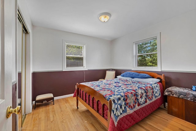 bedroom featuring hardwood / wood-style flooring and a closet