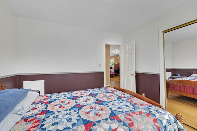 bedroom with wood finished floors