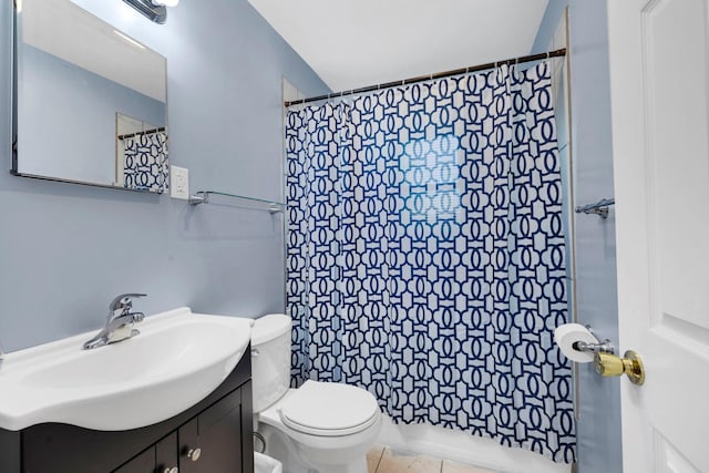 bathroom with toilet, vanity, a shower with curtain, and tile patterned floors