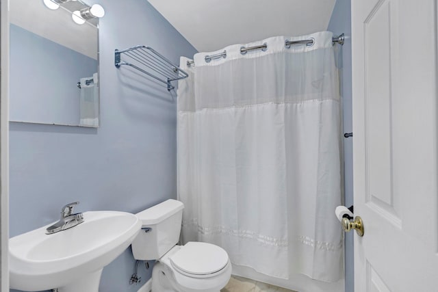 bathroom featuring a sink and toilet