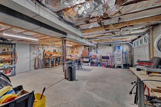 unfinished basement with a workshop area