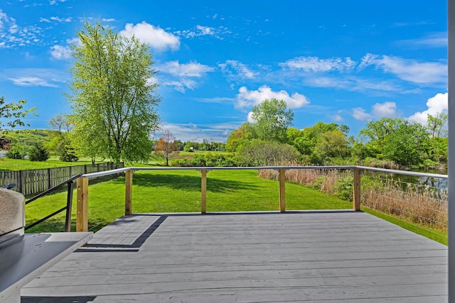 wooden terrace with a yard