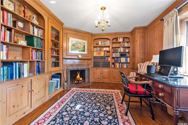3 Barkers Point Rd, Sands Point, NY 11050 - office area featuring a chandelier, built in shelves, wood finished floors, and a fireplace