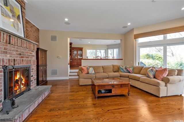 3 Barkers Point Rd, Sands Point, NY 11050 - living area featuring a brick fireplace, dark wood finished floors, recessed lighting, and baseboards