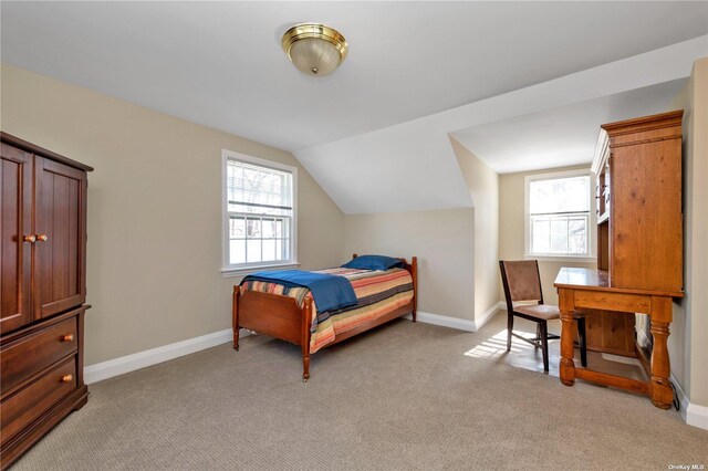 3 Barkers Point Rd, Sands Point, NY 11050 - bedroom featuring light colored carpet, multiple windows, baseboards, and lofted ceiling