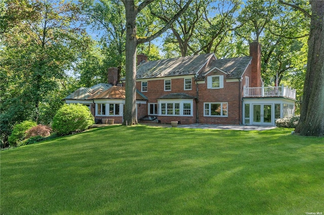3 Barkers Point Rd, Sands Point, NY 11050 - rear view of property with french doors, a chimney, a yard, and brick siding