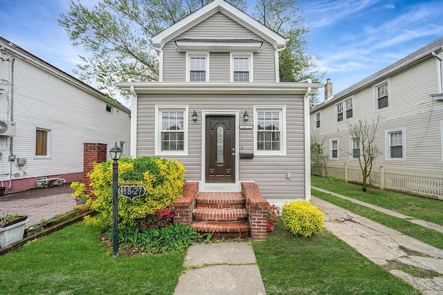 11827 219th St, Cambria Heights, NY 11411 - view of front of house with a cooling unit