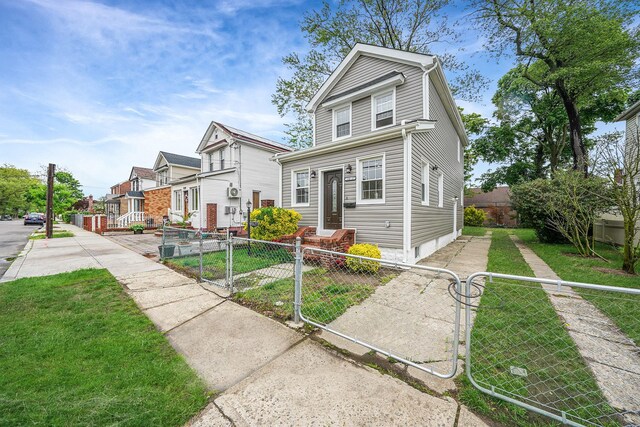 11827 219th St, Cambria Heights, NY 11411 - view of front facade featuring a gate