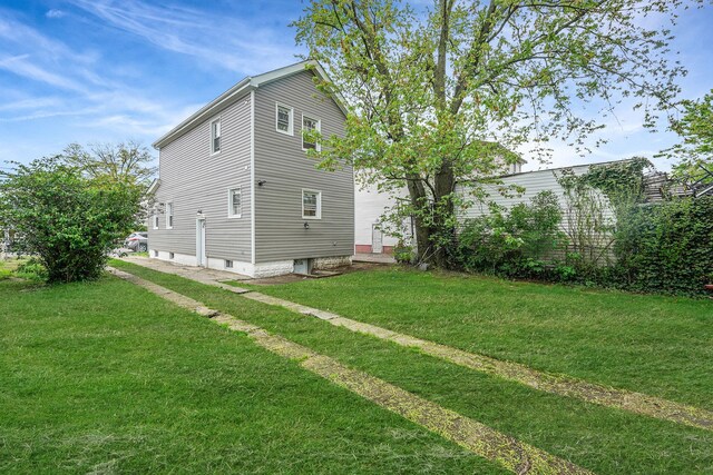 11827 219th St, Cambria Heights, NY 11411 - back of property with a lawn