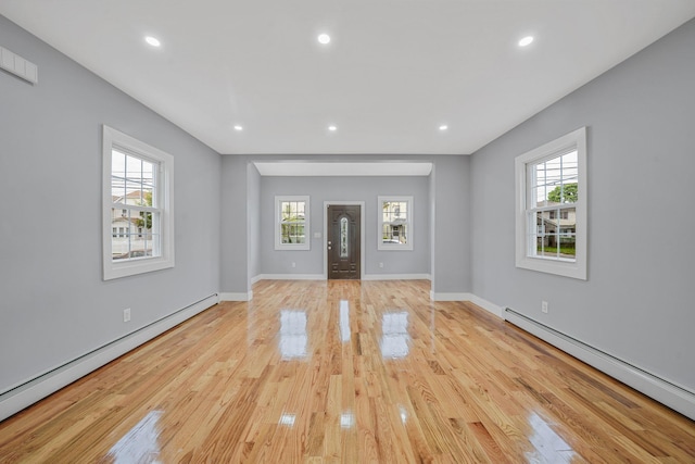 11827 219th St, Cambria Heights, NY 11411 - foyer featuring a baseboard radiator, light wood-style floors, baseboards, and recessed lighting