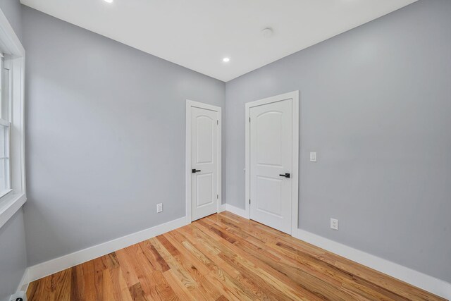 11827 219th St, Cambria Heights, NY 11411 - unfurnished room featuring baseboards, light wood-style flooring, and recessed lighting