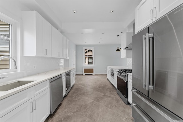 kitchen with appliances with stainless steel finishes, wine cooler, a sink, under cabinet range hood, and white cabinets