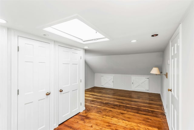 8 Hazel Rd, Port Washington, NY 11050 - bonus room with recessed lighting, lofted ceiling, wood finished floors, and a skylight