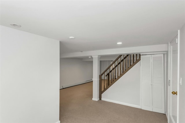 8 Hazel Rd, Port Washington, NY 11050 - finished below grade area featuring a baseboard heating unit, carpet flooring, stairs, and recessed lighting