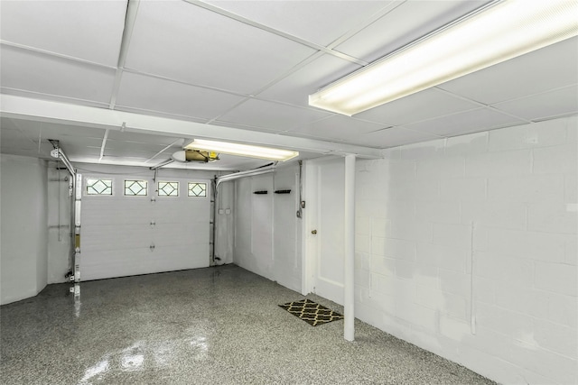 8 Hazel Rd, Port Washington, NY 11050 - garage with concrete block wall and a garage door opener