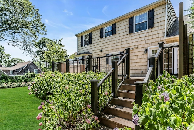 8 Hazel Rd, Port Washington, NY 11050 - view of front of house with a front yard