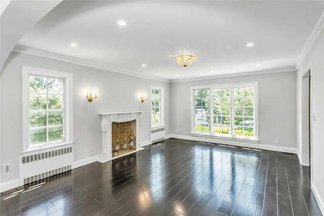 8 Hazel Rd, Port Washington, NY 11050 - unfurnished living room featuring radiator, a premium fireplace, wood finished floors, crown molding, and recessed lighting