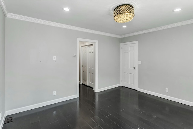 8 Hazel Rd, Port Washington, NY 11050 - empty room featuring ornamental molding, wood finished floors, recessed lighting, and a chandelier