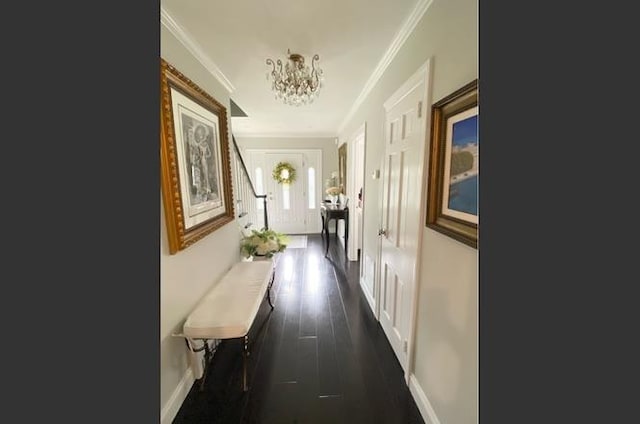 8 Hazel Rd, Port Washington, NY 11050 - hallway featuring a chandelier, ornamental molding, and dark wood finished floors