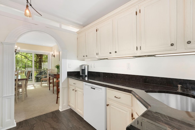 48 Clarewood Dr, Hastings-On-Hudson, NY 10706 - kitchen featuring dishwasher, arched walkways, dark countertops, pendant lighting, and a sink