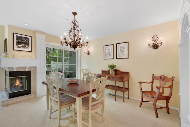 48 Clarewood Dr, Hastings-On-Hudson, NY 10706 - carpeted dining area featuring a chandelier, a tile fireplace, baseboards, and recessed lighting