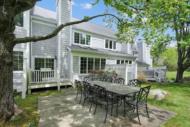 48 Clarewood Dr, Hastings-On-Hudson, NY 10706 - rear view of property with a deck, a yard, roof with shingles, and a chimney