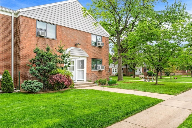 67-15 Bell Blvd Duplex, Unit Duplex, Bayside, NY 11364 - multi unit property featuring a front lawn, brick siding, and cooling unit