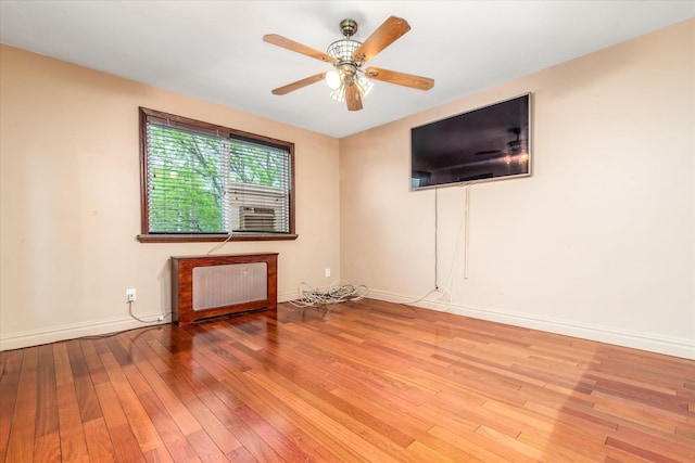 67-15 Bell Blvd Duplex, Unit Duplex, Bayside, NY 11364 - unfurnished living room with radiator, wood-type flooring, baseboards, and ceiling fan