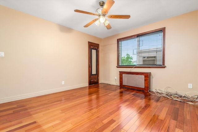 67-15 Bell Blvd Duplex, Unit Duplex, Bayside, NY 11364 - unfurnished room featuring radiator, hardwood / wood-style flooring, ceiling fan, and baseboards