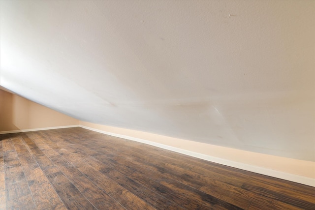 67-15 Bell Blvd Duplex, Unit Duplex, Bayside, NY 11364 - unfurnished room with dark wood-style flooring, lofted ceiling, and baseboards