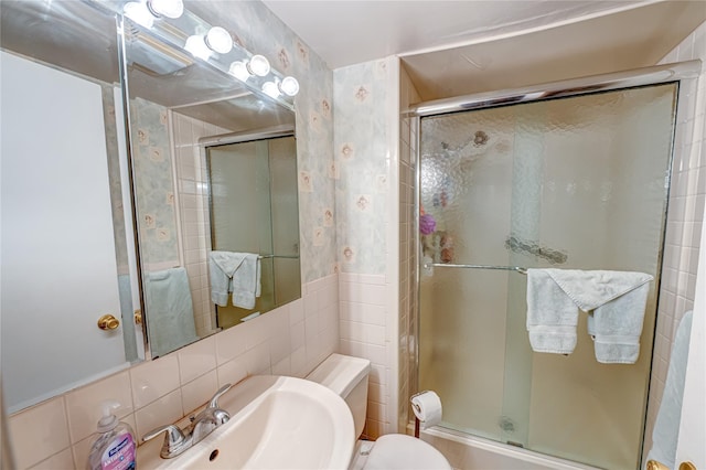 86 Vincent Rd, Hicksville, NY 11801 - full bathroom featuring a stall shower, tile walls, toilet, a sink, and wallpapered walls